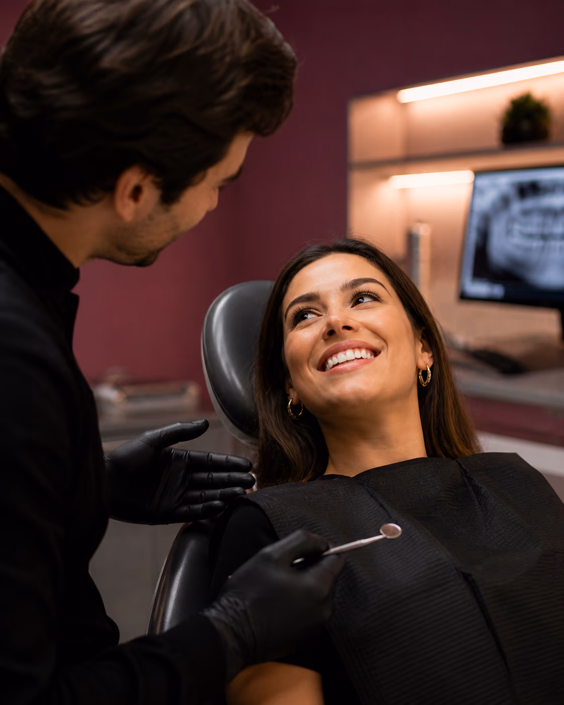 Patient smiling during consultation at Smilery